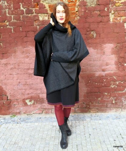 IMG 9321 Black-wool poncho with knitted hems and turtleneck The elegant poncho 150 x100 cm made of 100% wool / fabric / has a massive knitted black ribbed turtleneck in an obliquely cut center, into which you can snuggle or fold. The whole poncho is lined with a black 1.5 cm knitted cavity. 100% wool + yarn 100% wool Colors - black, black mottled, gray-black - hems and turtleneck are always black. Maintenance - we recommend dry cleaning or washing by hand in lukewarm water, then spread on a towel. no sizes 140x100cm The elegant poncho 150 x100 cm made of 100% wool / fabric / has a massive knitted black ribbed turtleneck in an obliquely cut center, into which you can snuggle or fold. The whole poncho is lined with a black 1.5 cm knitted cavity. 100% wool + yarn 100% wool Colors - black, black mottled, gray-black - hems and turtleneck are always black. Maintenance - we recommend dry cleaning or washing by hand in lukewarm water, then spread on a towel. no sizes 140x100cm