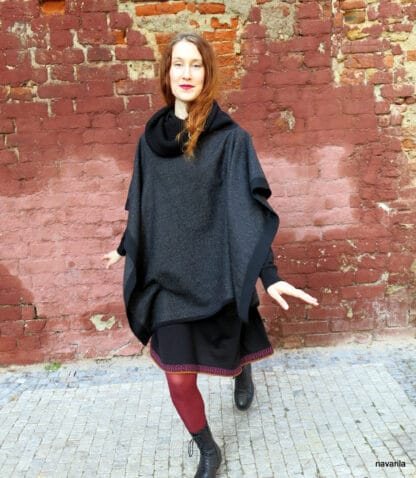 IMG 9333 Black-wool poncho with knitted hems and turtleneck The elegant poncho 150 x100 cm made of 100% wool / fabric / has a massive knitted black ribbed turtleneck in an obliquely cut center, into which you can snuggle or fold. The whole poncho is lined with a black 1.5 cm knitted cavity. 100% wool + yarn 100% wool Colors - black, black mottled, gray-black - hems and turtleneck are always black. Maintenance - we recommend dry cleaning or washing by hand in lukewarm water, then spread on a towel. no sizes 140x100cm The elegant poncho 150 x100 cm made of 100% wool / fabric / has a massive knitted black ribbed turtleneck in an obliquely cut center, into which you can snuggle or fold. The whole poncho is lined with a black 1.5 cm knitted cavity. 100% wool + yarn 100% wool Colors - black, black mottled, gray-black - hems and turtleneck are always black. Maintenance - we recommend dry cleaning or washing by hand in lukewarm water, then spread on a towel. no sizes 140x100cm