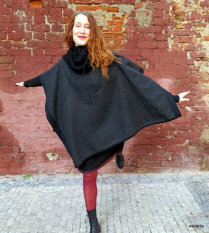 IMG 9334 Black-wool poncho with knitted hems and turtleneck The elegant poncho 150 x100 cm made of 100% wool / fabric / has a massive knitted black ribbed turtleneck in an obliquely cut center, into which you can snuggle or fold. The whole poncho is lined with a black 1.5 cm knitted cavity. 100% wool + yarn 100% wool Colors - black, black mottled, gray-black - hems and turtleneck are always black. Maintenance - we recommend dry cleaning or washing by hand in lukewarm water, then spread on a towel. no sizes 140x100cm The elegant poncho 150 x100 cm made of 100% wool / fabric / has a massive knitted black ribbed turtleneck in an obliquely cut center, into which you can snuggle or fold. The whole poncho is lined with a black 1.5 cm knitted cavity. 100% wool + yarn 100% wool Colors - black, black mottled, gray-black - hems and turtleneck are always black. Maintenance - we recommend dry cleaning or washing by hand in lukewarm water, then spread on a towel. no sizes 140x100cm