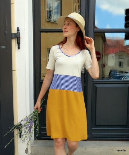 IMG 8774 ELOE II.- summer dress Summer dress with short sleeves with a knitted cream top and a yellow skirt made of flowing fabric made of viscose silk and a blue and white striped waist. The neckline is lined with the same blue and white stripe. Top composition - cotton + elastane + modal They will immediately become your favorite piece, suitable for almost all characters. Size.S All materials are already pre-washed, so they will not shrink! Easy maintenance - wash for a delicate program up to 30 degrees. MADE WITH LOVE IN CZECH REPUBLIC! Summer dress with short sleeves with a knitted cream top and a yellow skirt made of flowing fabric made of viscose silk and a blue and white striped waist. The neckline is lined with the same blue and white stripe. Top composition - cotton + elastane + modal They will immediately become your favorite piece, suitable for almost all characters. Size.S All materials are already pre-washed, so they will not shrink! Easy maintenance - wash for a delicate program up to 30 degrees. MADE WITH LOVE IN CZECH REPUBLIC!