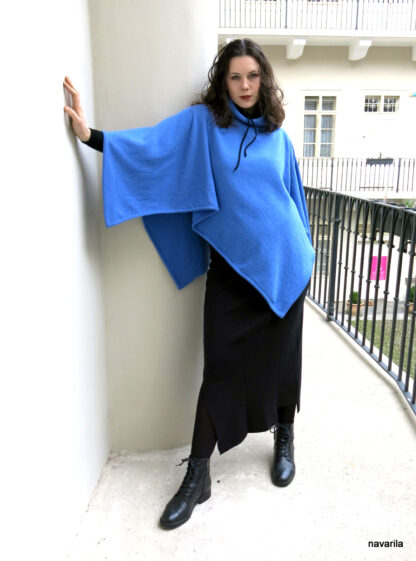 IMG 4110 BLUE- woolen poncho with turtleneck Sky blue poncho 120 x 120 cm knitted from merino wool, in the diagonally cut center knitted ribbed turtleneck. 80% merino wool + 20% polyester Maintenance - we recommend hand washing in lukewarm water, then spread on a towel. Only one unique original model. ​ Sky blue poncho 120 x 120 cm knitted from merino wool, in the diagonally cut center knitted ribbed turtleneck. 80% merino wool + 20% polyester Maintenance - we recommend hand washing in lukewarm water, then spread on a towel. Only one unique original model. ​