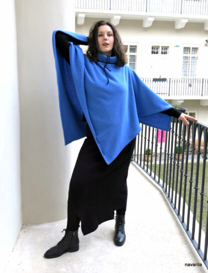 IMG 4125 BLUE- woolen poncho with turtleneck Sky blue poncho 120 x 120 cm knitted from merino wool, in the diagonally cut center knitted ribbed turtleneck. 80% merino wool + 20% polyester Maintenance - we recommend hand washing in lukewarm water, then spread on a towel. Only one unique original model. ​ Sky blue poncho 120 x 120 cm knitted from merino wool, in the diagonally cut center knitted ribbed turtleneck. 80% merino wool + 20% polyester Maintenance - we recommend hand washing in lukewarm water, then spread on a towel. Only one unique original model. ​